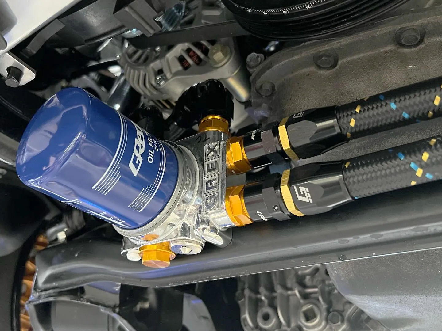 GReddy Durable Nylon Braided -4 Hose in Black, Gold, and Blue Finish