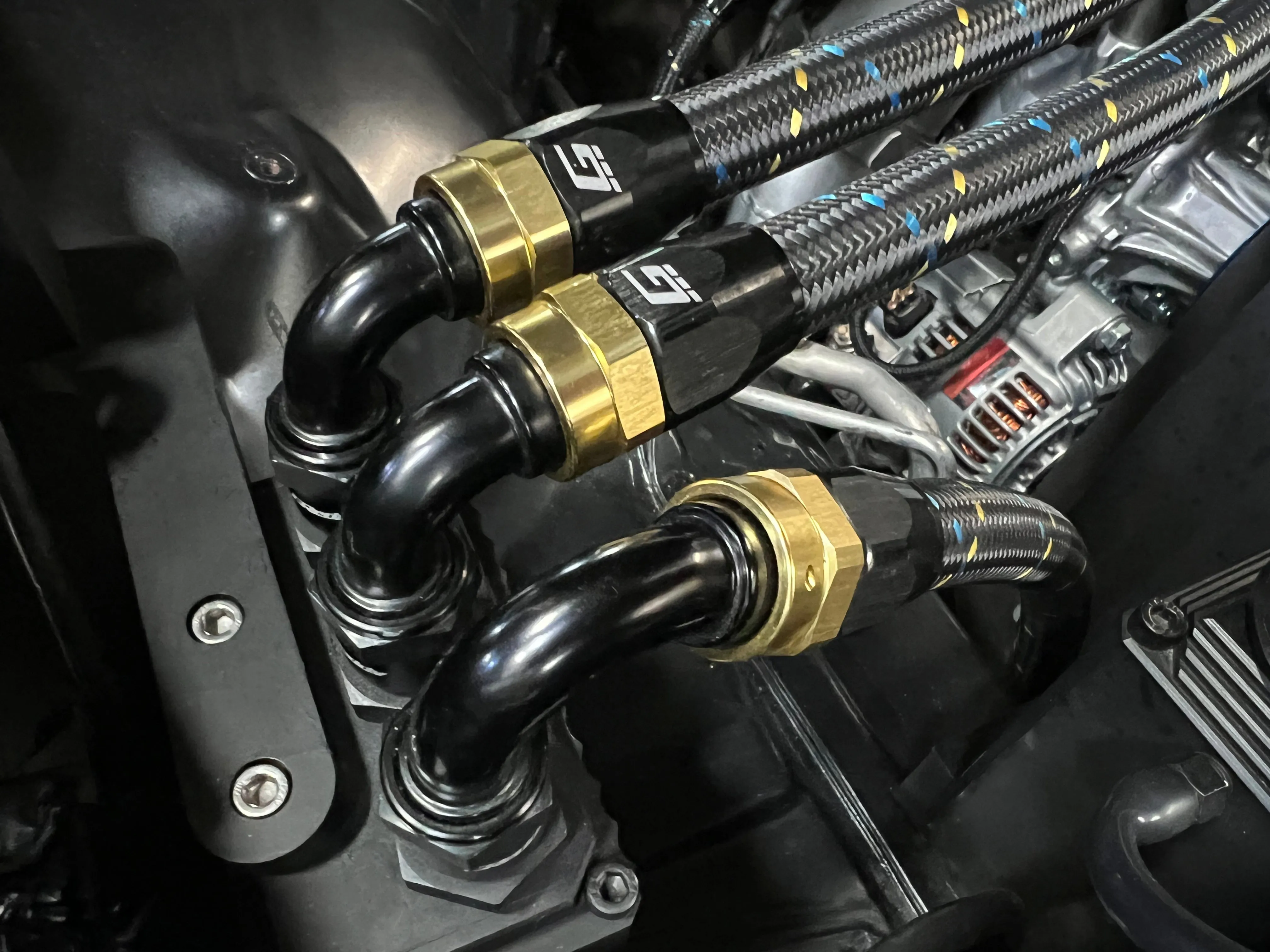 GReddy Durable Nylon Braided -4 Hose in Black, Gold, and Blue Finish