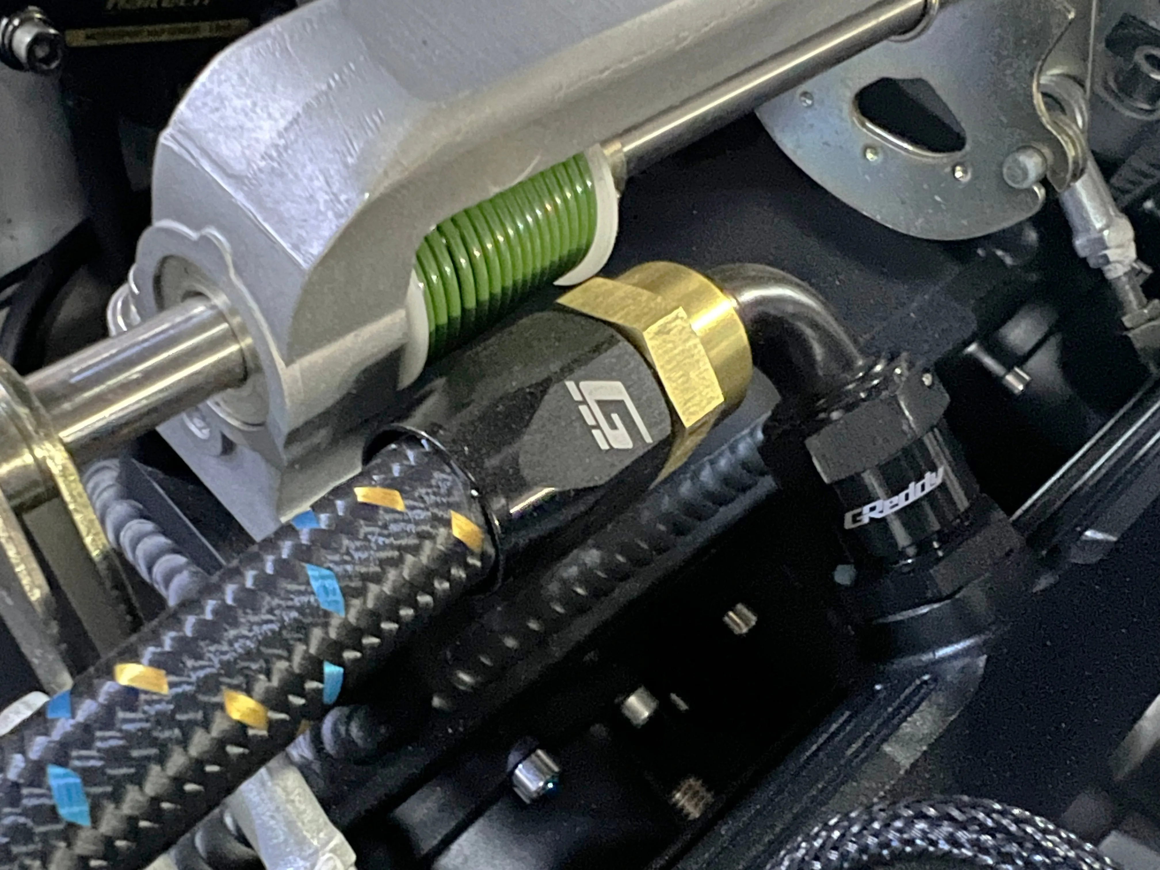 GReddy Durable Nylon Braided -4 Hose in Black, Gold, and Blue Finish