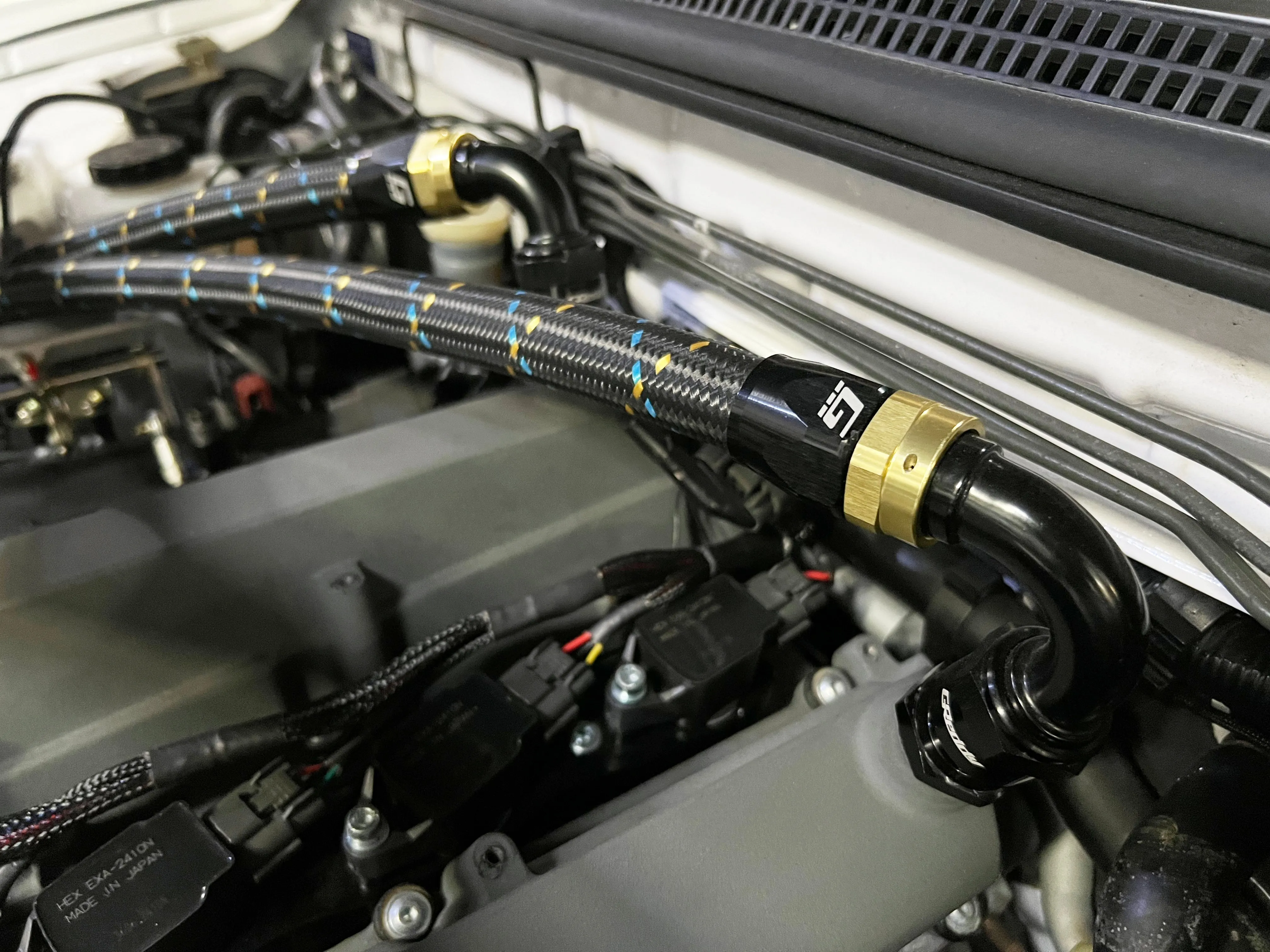 GReddy Durable Nylon Braided -4 Hose in Black, Gold, and Blue Finish