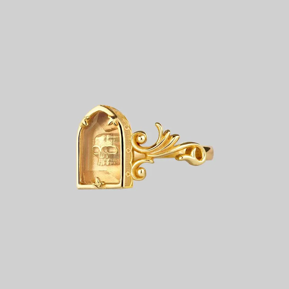 OMINOUS. Skull Under Glass Ring - Gold
